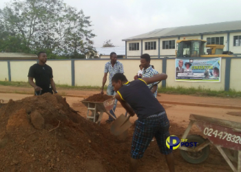 Ejisu-Abankro taxi drivers fill potholes on their road after authorities failed to fix it