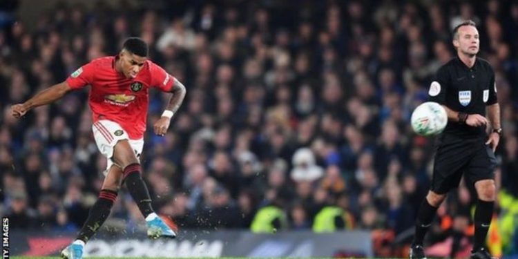 Rashford double sends Man Utd through