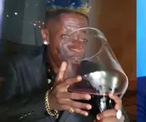 Shatta Wale causes stir for drinking from huge wine glass
