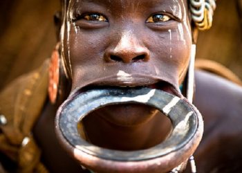 The mysterious history and meanings of African tribal lip plates and why women wear them