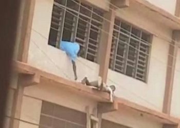 ‘Spiderman’ sneaks WASSCE answers to students on top floor with ladder
