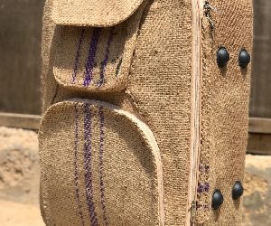 Skillful Ghanaian artisan repurposes cocoa sack into luxury traveling bag