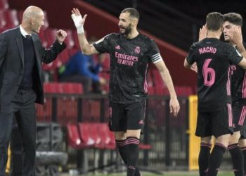 Real Madrid beat Granada to keep title dream alive