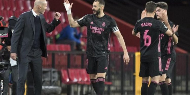 Real Madrid beat Granada to keep title dream alive