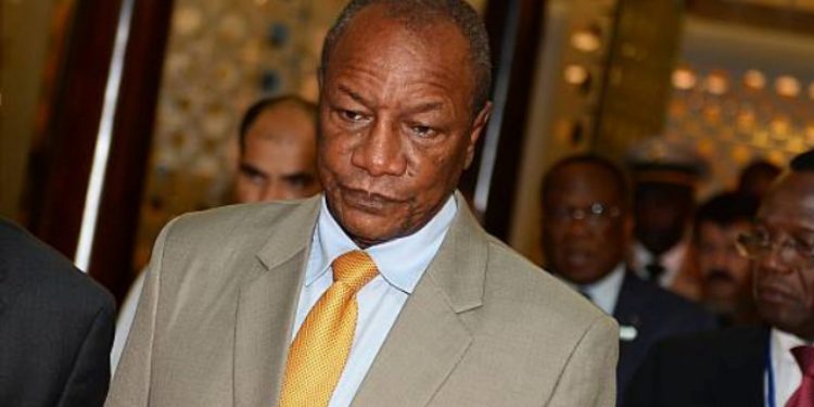 Guinea junta says ex-president at home with his wife