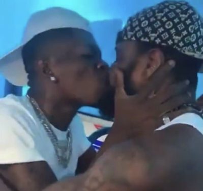 Shatta Wale kissing male bodyguard sparks controversy