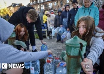 Ukraine war: Kyiv locals queue for water after Russian strikes