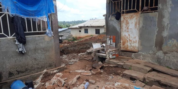 Woman killed as mining pit dug under house collapses