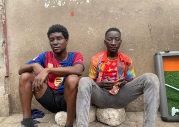 Two arrested for allegedly stealing goods from shops gutted by fire at Adum